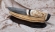 Подарочный Нож Барракуда сталь дамаск торцевой, рукоять мокуме-гане черный граб бивень моржа резной на подставке
