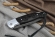 Складной нож Ворон, сталь Х12МФ, рукоять накладки черный граб резная с дюралью