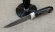 Авторский нож Походный сталь дамаск-долы, рукоять черный граб резной с инкрустацией на подставке