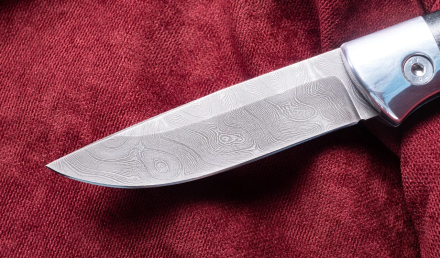 Выкидной нож "Волк" сталь дамаск, накладки G10 черная 