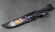 Нож Косуля ламинация S 390 в  крученом дамаске, мокуме-гане акрил черный, скримшоу Титаник