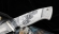 Коллекционный нож Барракуда ламинация S 390 в  крученом дамаске, серебро акрил белый, скримшоу Джокер