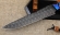 Нож Алькор дамаск ламинированный рукоять и ножны карельская береза янтарь, зубы мамонта на подставке