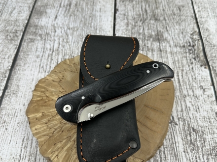 Нож складной Зубр сталь Х12МФ накладки g10 черная с оранжевой проставкой