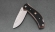 Нож Шершень, складной, сталь Х12МФ со штифтом, рукоять накладки G10 черная с оранжевым, клипса